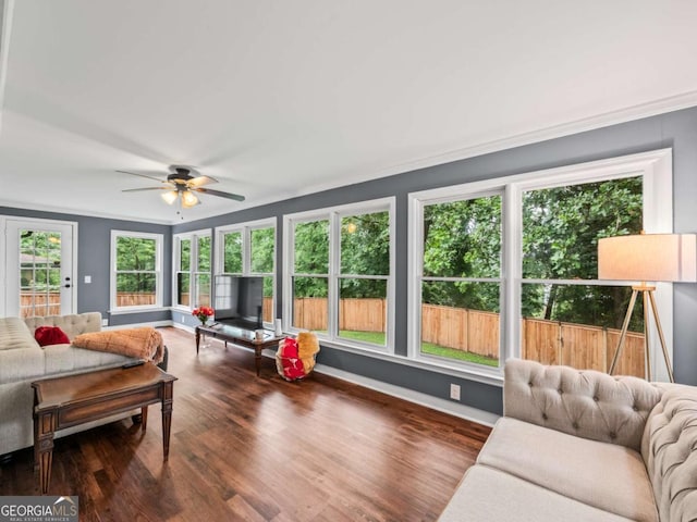 1488 Vine St NE, Gainesville, GA 30501 - living area featuring wood finished floors, ceiling fan, baseboards, and ornamental molding