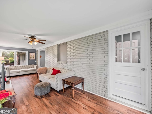 1488 Vine St NE, Gainesville, GA 30501 - living room featuring brick wall, ceiling fan, and wood finished floors