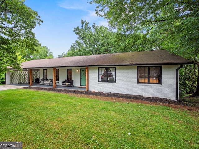 1488 Vine St NE, Gainesville, GA 30501 - view of front of property featuring a front yard, brick siding, driveway, a carport, and roof with shingles