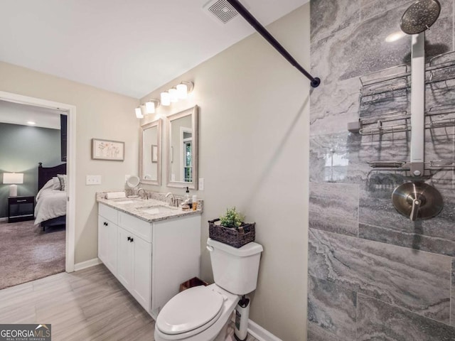 1488 Vine St NE, Gainesville, GA 30501 - ensuite bathroom with vanity, tiled shower, toilet, and baseboards