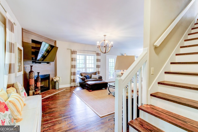 86 Waters Dr, Wedowee, AL 36278 - living room with stairs, a chandelier, wood finished floors, and a fireplace