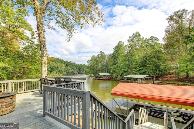 86 Waters Dr, Wedowee, AL 36278 - wooden deck featuring a water view, a dock, boat lift, and a forest view