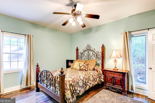 86 Waters Dr, Wedowee, AL 36278 - bedroom with multiple windows, wood finished floors, and ceiling fan