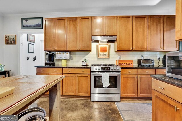 2295 Hemrick Rd, Cumming, GA 30041 - kitchen featuring appliances with stainless steel finishes, under cabinet range hood, decorative backsplash, crown molding, and dark stone counters