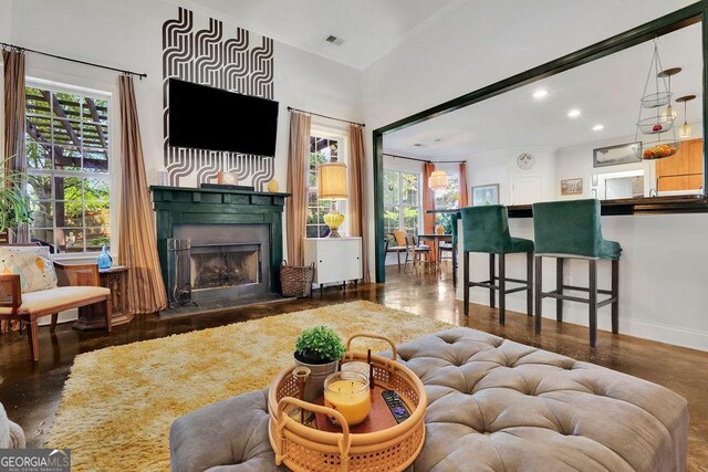 2295 Hemrick Rd, Cumming, GA 30041 - living room featuring a fireplace, healthy amount of natural light, recessed lighting, wood finished floors, and ornamental molding