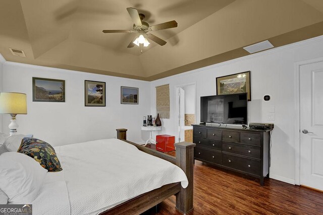 2295 Hemrick Rd, Cumming, GA 30041 - bedroom featuring dark wood-type flooring, a raised ceiling, and a ceiling fan