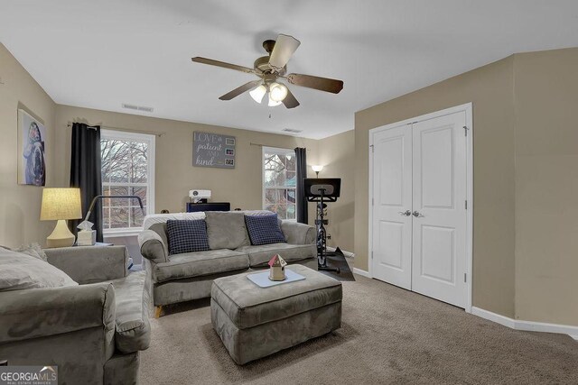 2295 Hemrick Rd, Cumming, GA 30041 - carpeted living room with ceiling fan and baseboards
