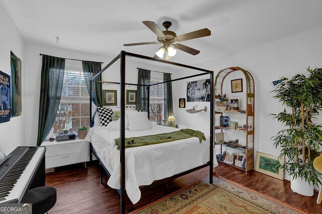 2295 Hemrick Rd, Cumming, GA 30041 - bedroom featuring wood finished floors, a ceiling fan, and radiator