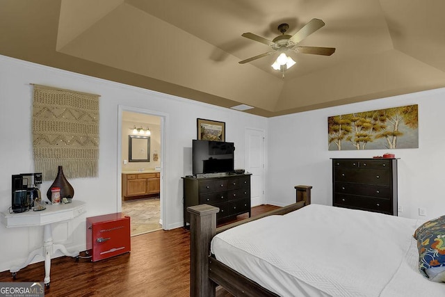 2295 Hemrick Rd, Cumming, GA 30041 - bedroom with dark wood-style flooring, ensuite bathroom, a tray ceiling, and a ceiling fan