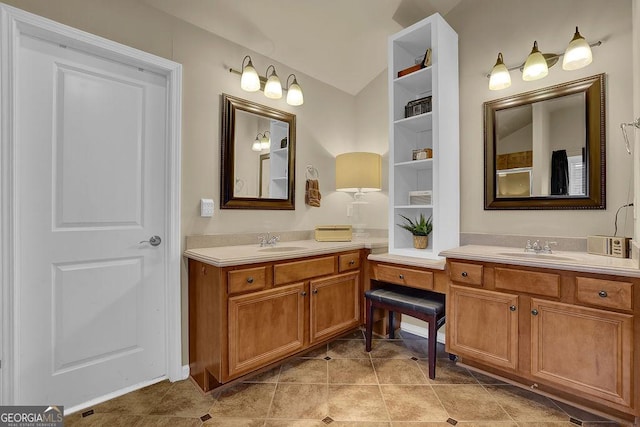 2295 Hemrick Rd, Cumming, GA 30041 - bathroom featuring vaulted ceiling, two vanities, and tile patterned floors