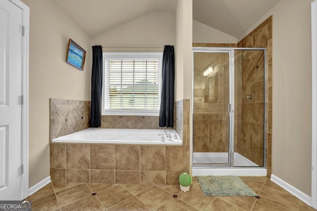 2295 Hemrick Rd, Cumming, GA 30041 - full bathroom with tile patterned flooring, a shower stall, a bath, and vaulted ceiling