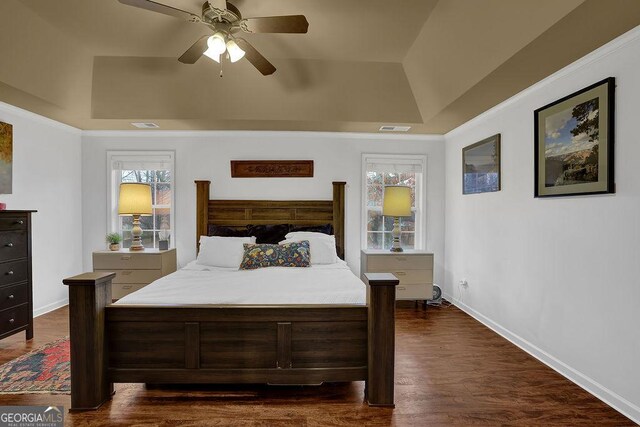2295 Hemrick Rd, Cumming, GA 30041 - bedroom with a raised ceiling, dark wood-type flooring, and ceiling fan