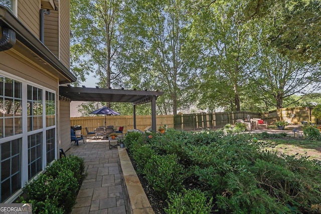 2295 Hemrick Rd, Cumming, GA 30041 - fenced backyard with a patio and a pergola