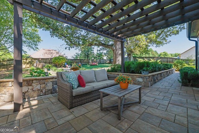 2295 Hemrick Rd, Cumming, GA 30041 - fenced backyard featuring a patio, outdoor lounge area, and a pergola