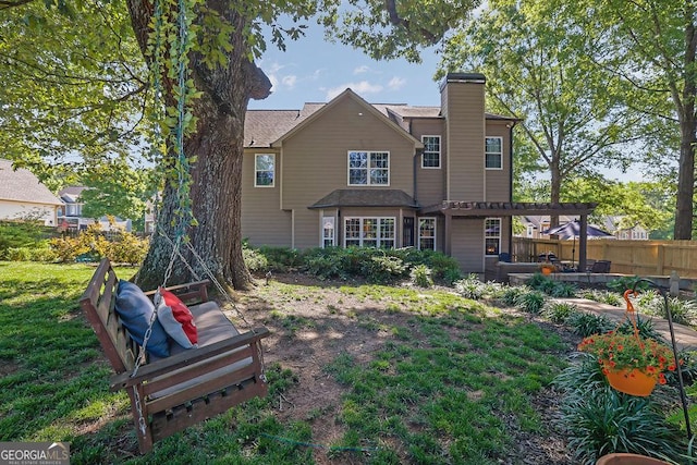 2295 Hemrick Rd, Cumming, GA 30041 - rear view of house featuring a chimney, a pergola, and a patio area