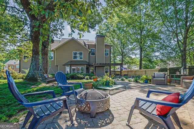 2295 Hemrick Rd, Cumming, GA 30041 - view of patio / terrace featuring an outdoor fire pit