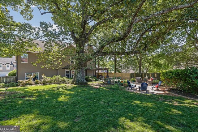 2295 Hemrick Rd, Cumming, GA 30041 - view of yard featuring a patio and an outdoor fire pit