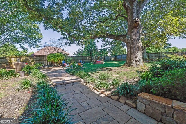 2295 Hemrick Rd, Cumming, GA 30041 - fenced backyard featuring a patio
