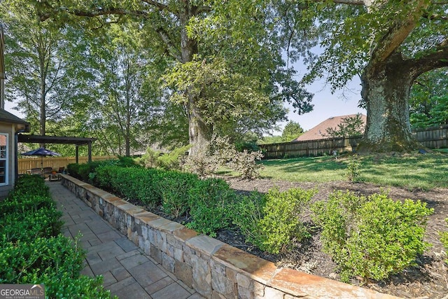 2295 Hemrick Rd, Cumming, GA 30041 - fenced backyard featuring a patio
