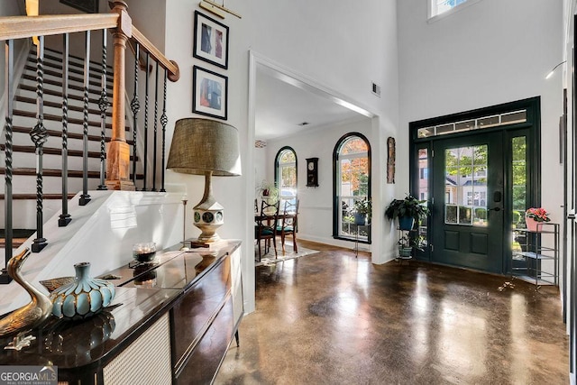 2295 Hemrick Rd, Cumming, GA 30041 - entrance foyer with stairs, a towering ceiling, and concrete flooring