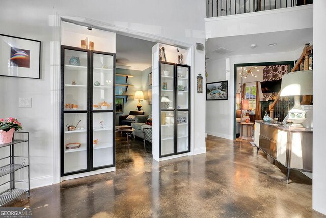 2295 Hemrick Rd, Cumming, GA 30041 - foyer with baseboards and finished concrete floors