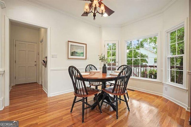 1206 Mountainside Trce NW, Kennesaw, GA 30152 - dining space featuring light wood-type flooring, crown molding, and baseboards