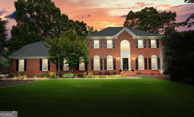 1206 Mountainside Trce NW, Kennesaw, GA 30152 - colonial inspired home with a lawn and brick siding