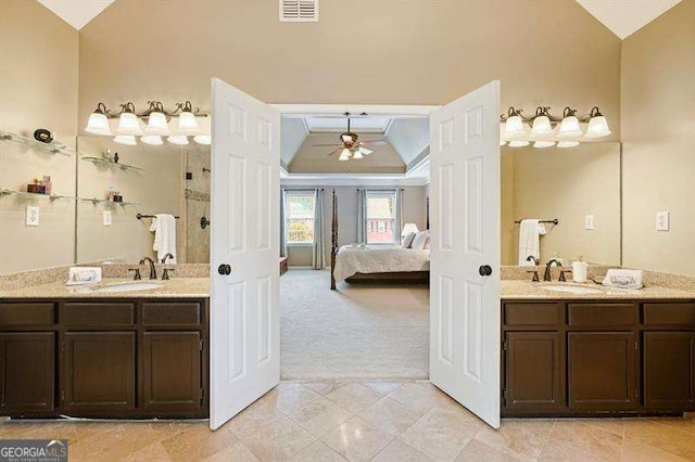 1206 Mountainside Trce NW, Kennesaw, GA 30152 - ensuite bathroom with ceiling fan, two vanities, a raised ceiling, tiled shower, and lofted ceiling