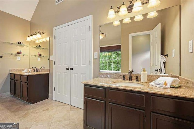 1206 Mountainside Trce NW, Kennesaw, GA 30152 - full bathroom featuring two vanities, tile patterned floors, and lofted ceiling