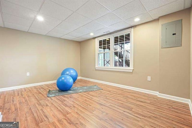 1206 Mountainside Trce NW, Kennesaw, GA 30152 - exercise area featuring electric panel, baseboards, wood finished floors, a paneled ceiling, and recessed lighting