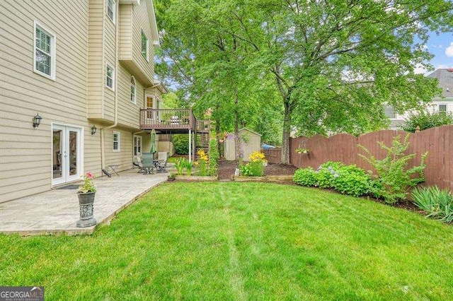 1206 Mountainside Trce NW, Kennesaw, GA 30152 - view of yard featuring a deck, a patio area, and french doors