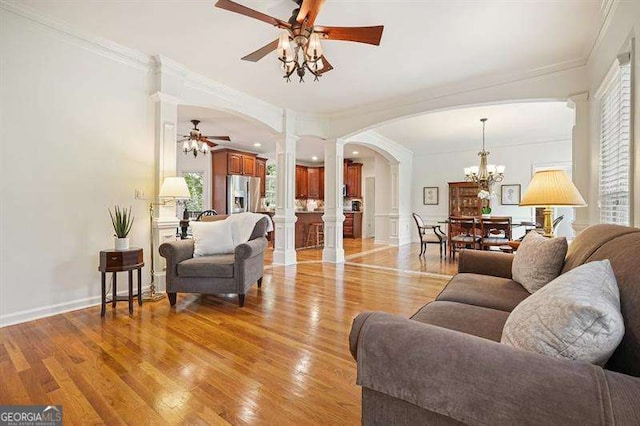 1206 Mountainside Trce NW, Kennesaw, GA 30152 - living room with ceiling fan, decorative columns, arched walkways, light wood finished floors, and ornamental molding