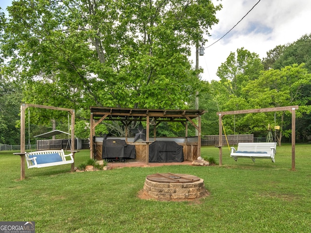 571 Swint Rd, Griffin, GA 30224 - view of yard featuring an outdoor fire pit and view of wooded area