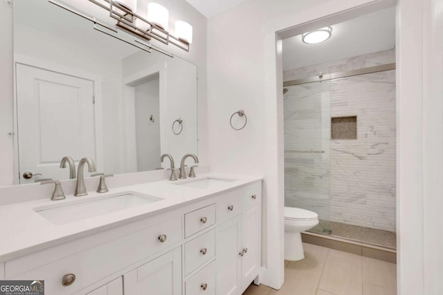 206 Tuxworth Cir, Decatur, GA 30033 - bathroom with toilet, a shower stall, double vanity, and tile patterned floors