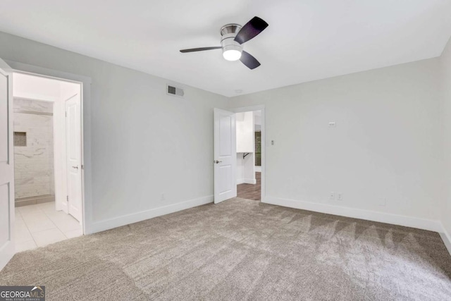 206 Tuxworth Cir, Decatur, GA 30033 - unfurnished bedroom with baseboards, carpet flooring, ensuite bath, and a ceiling fan