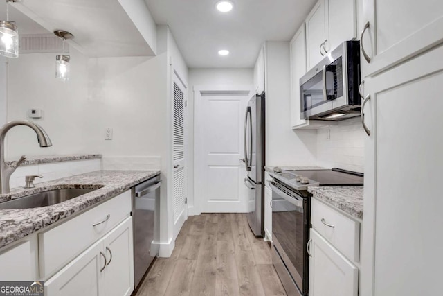 206 Tuxworth Cir, Decatur, GA 30033 - kitchen with appliances with stainless steel finishes, a sink, white cabinetry, and recessed lighting
