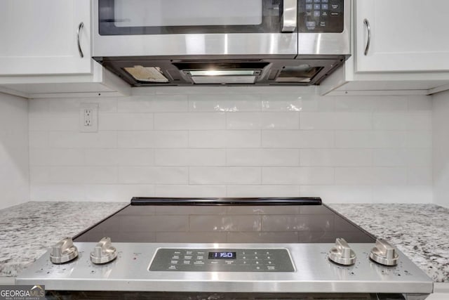 206 Tuxworth Cir, Decatur, GA 30033 - kitchen with stainless steel appliances, white cabinetry, and tasteful backsplash