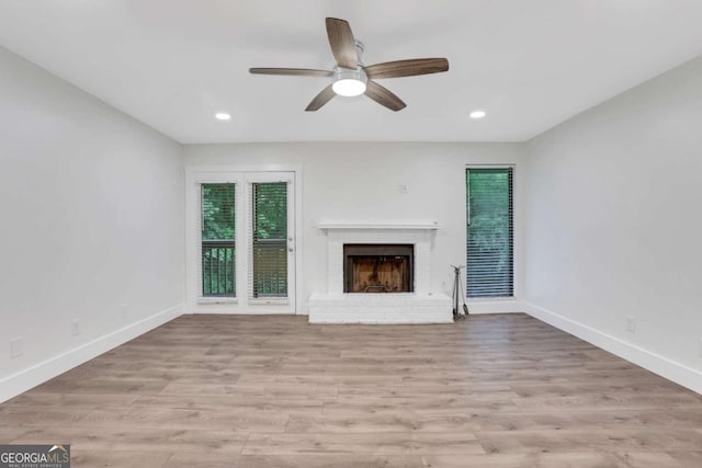 206 Tuxworth Cir, Decatur, GA 30033 - unfurnished living room featuring a brick fireplace, baseboards, ceiling fan, light wood-style floors, and recessed lighting