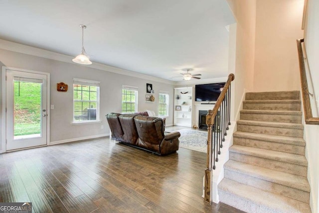 1300 Jefferson Walk Cir, Jefferson, GA 30549 - living room featuring stairway, crown molding, wood-type flooring, a fireplace, and ceiling fan