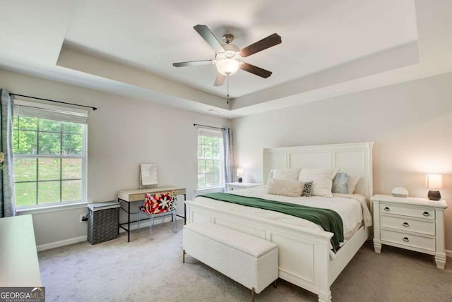 1300 Jefferson Walk Cir, Jefferson, GA 30549 - carpeted bedroom with a raised ceiling and a ceiling fan