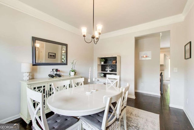 1300 Jefferson Walk Cir, Jefferson, GA 30549 - dining space with ornamental molding, dark wood-style floors, and a chandelier