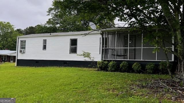 181 Pickens Rd, Westminster, SC 29693 - view of property exterior featuring crawl space, a yard, a sunroom, and cooling unit