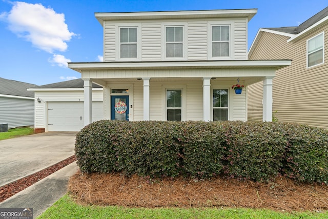 106 Thornton Dr, Bonaire, GA 31005 - traditional home with a porch, driveway, and a garage