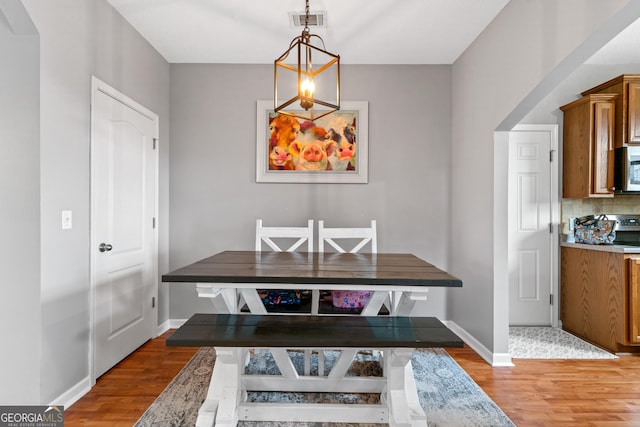 106 Thornton Dr, Bonaire, GA 31005 - dining area with light wood-type flooring and baseboards