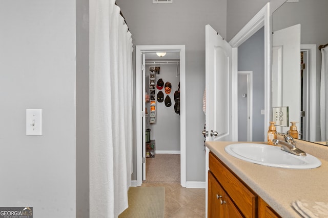 106 Thornton Dr, Bonaire, GA 31005 - bathroom with vanity, tile patterned flooring, baseboards, and a shower with curtain