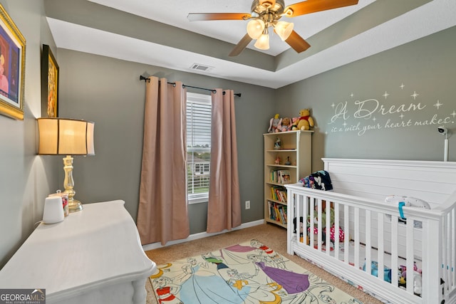 106 Thornton Dr, Bonaire, GA 31005 - bedroom with a crib, carpet flooring, baseboards, and a ceiling fan