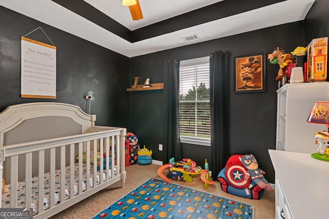 106 Thornton Dr, Bonaire, GA 31005 - bedroom with carpet floors, a crib, baseboards, and a ceiling fan