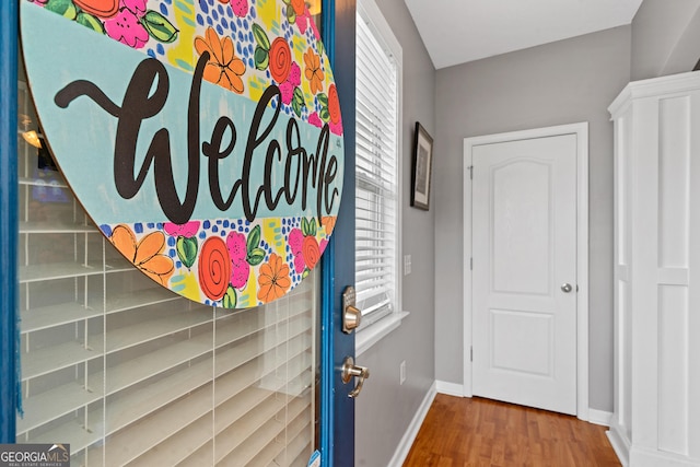106 Thornton Dr, Bonaire, GA 31005 - doorway to outside featuring baseboards and wood finished floors