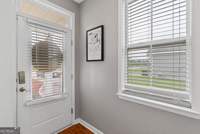 106 Thornton Dr, Bonaire, GA 31005 - entryway with baseboards and dark wood finished floors