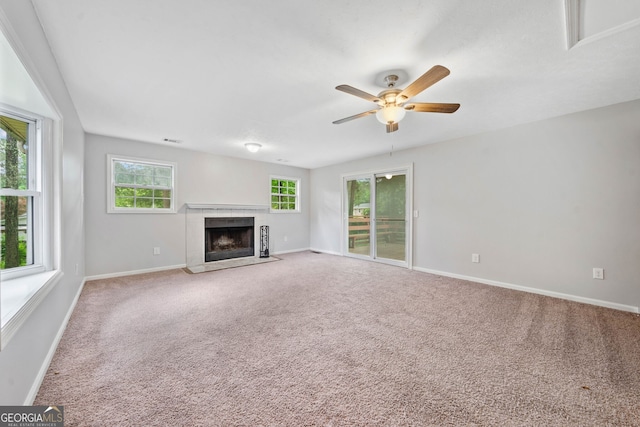 3047 Hudson Ct, Decatur, GA 30033 - unfurnished living room with carpet flooring, a ceiling fan, and a fireplace